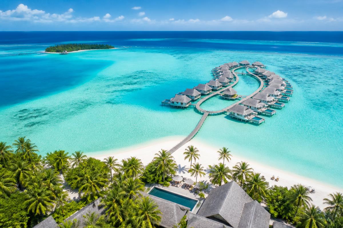 Overwater villas on a turquoise lagoon in the Maldives