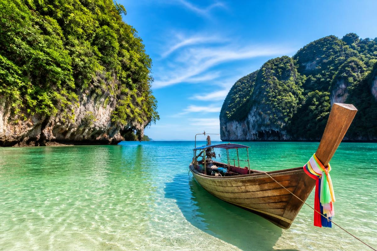 Longtail boat on a clear tropical bay in Thailand